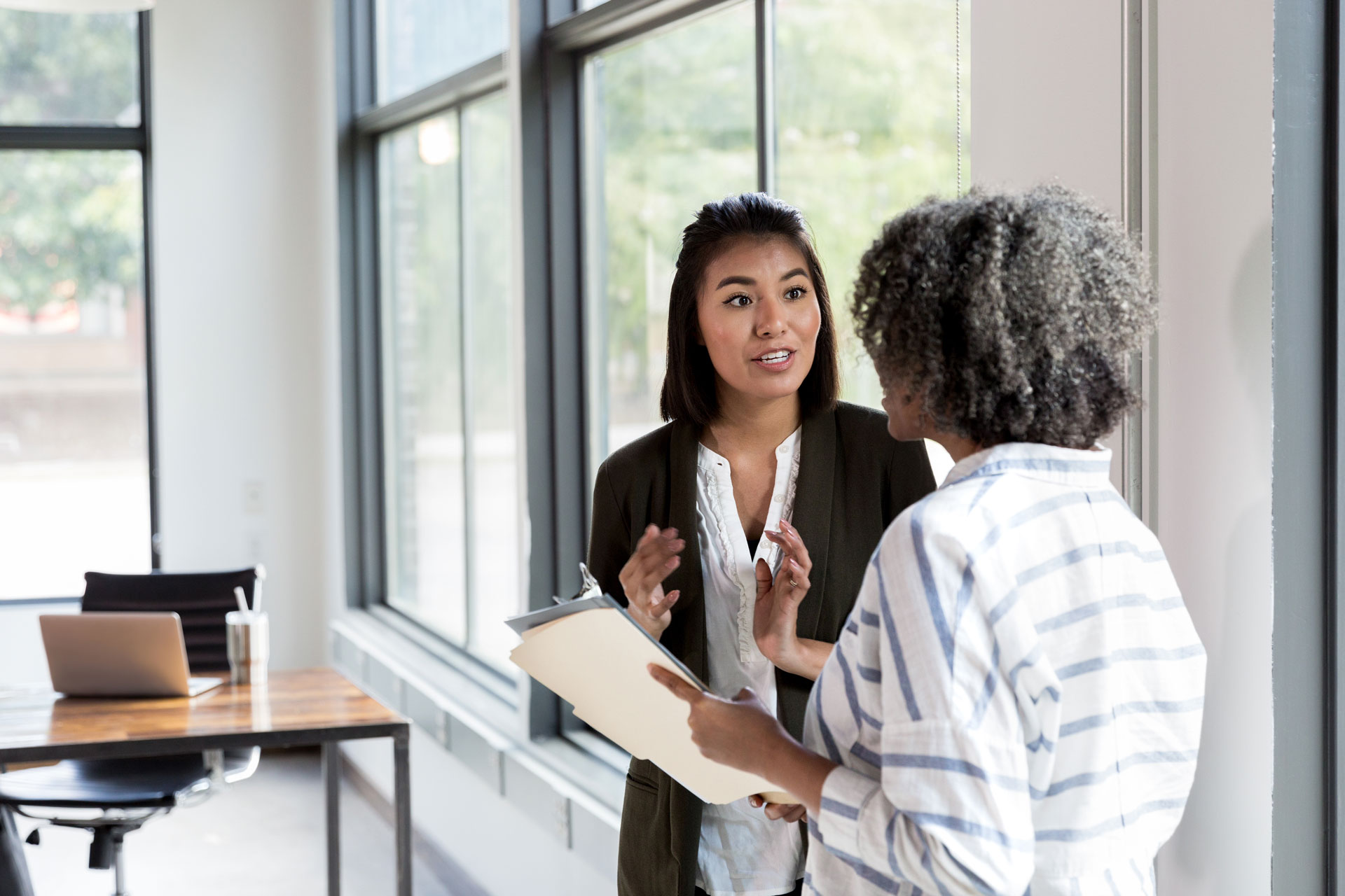 two women reviewing important documents