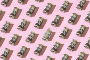 Rolls of twenty-dollar bills tied with rubber bands