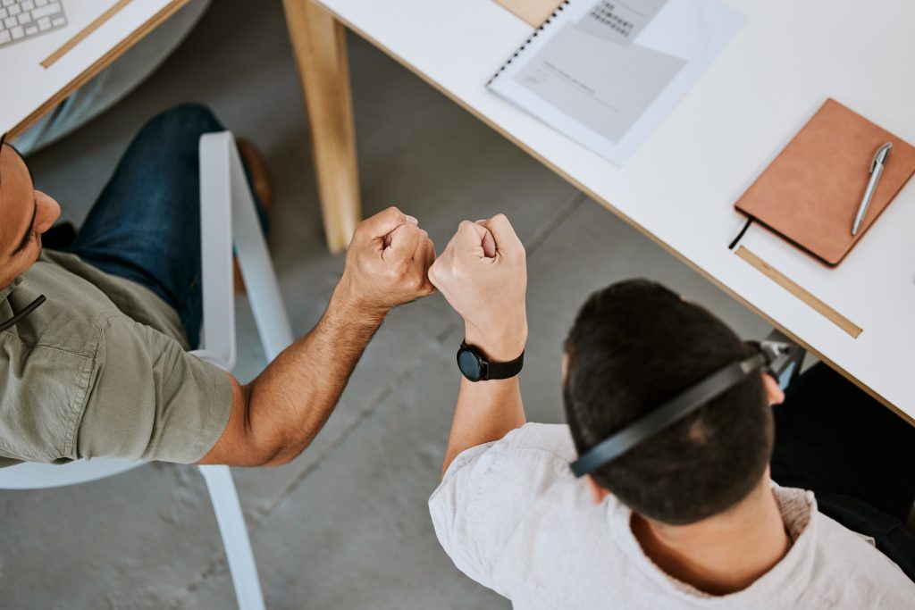 Call center agents fist bumping