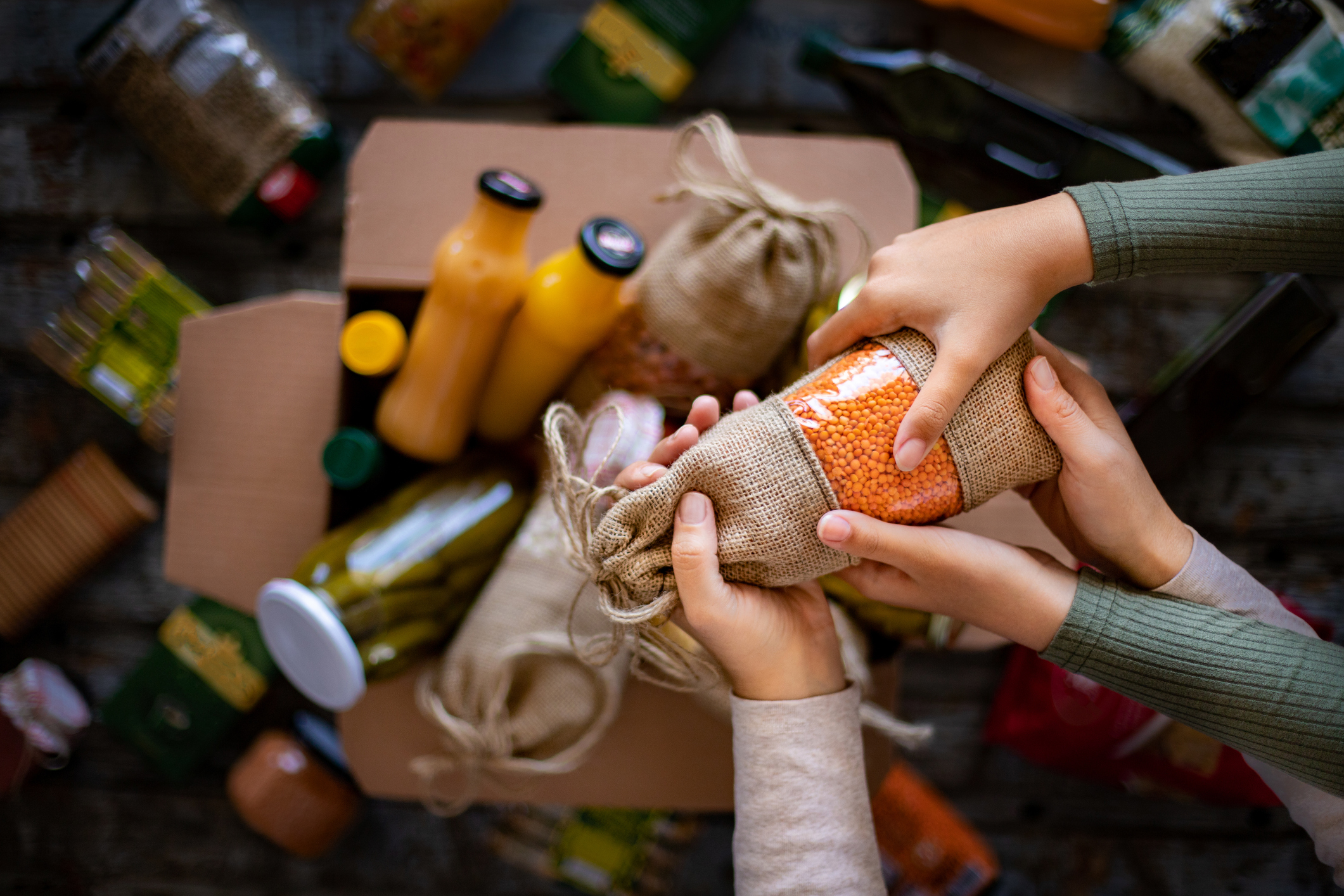 Volunteer with box of food for poor