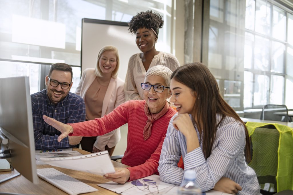 Business people discussing over new business project in office
